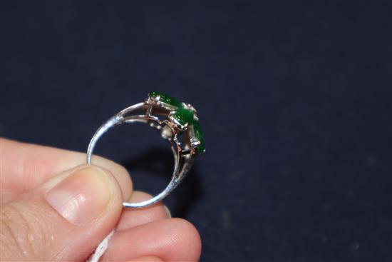 A modern 18k white metal, jadeite and diamond set flowerhead cluster ring, size P.